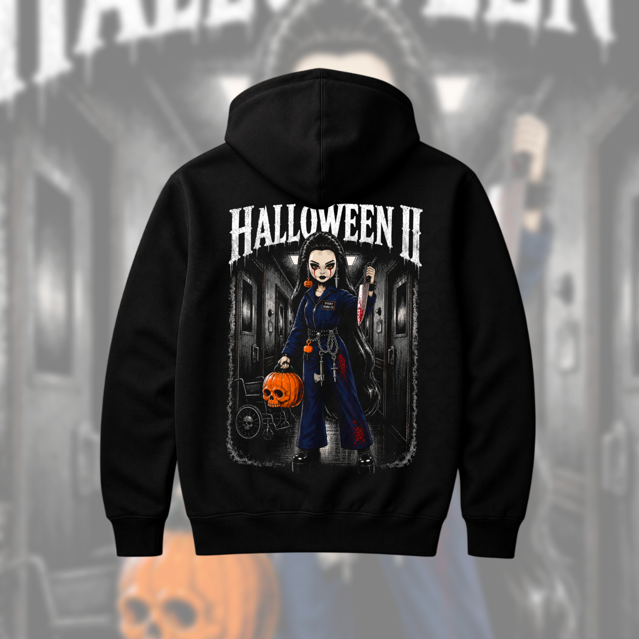 A black hoodie shown from the back, featuring a large graphic print of a cartoon-style character in a dark hallway holding a pumpkin, with the text 'HALLOWEEN II' above the artwork.